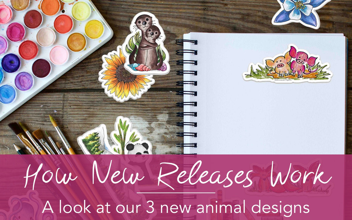 cute animal stickers laying on a table next to watercolor paints and a journal with the heading: How New Releases Work: A look at our 3 new animal designs
