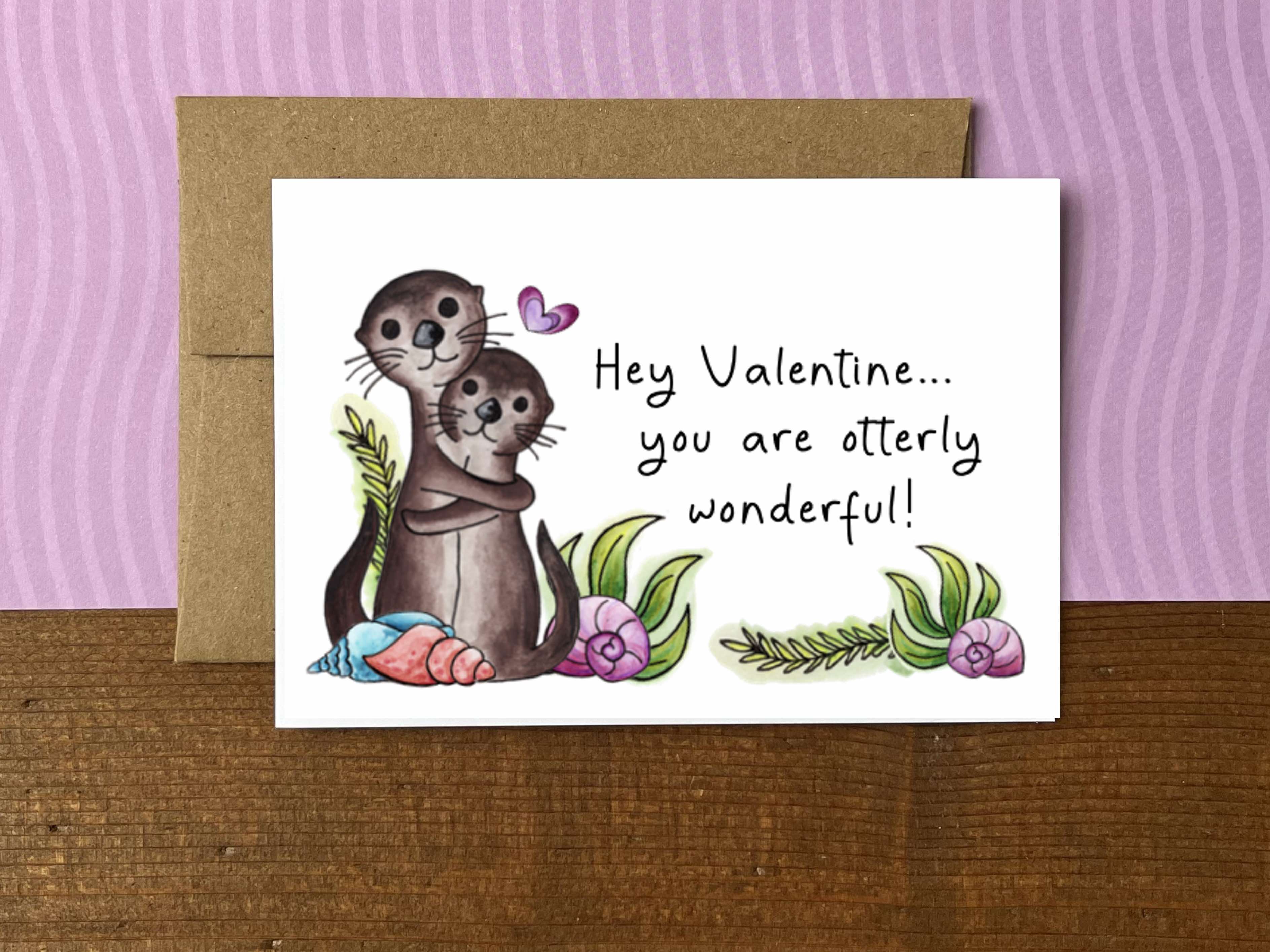 A Valentine's Day note card with an illustration of hugging otters and the message "Hey Valentine...you are otterly wonderfu!"