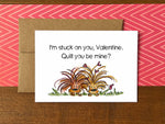 A Valentine's Day note card with an illustration of two porcupines, one with hearts in its quills and the message "I'm stuck on you, Valentine. Quill you be mine?"