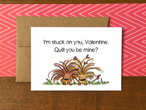 A Valentine's Day note card with an illustration of two porcupines, one with hearts in its quills and the message "I'm stuck on you, Valentine. Quill you be mine?"